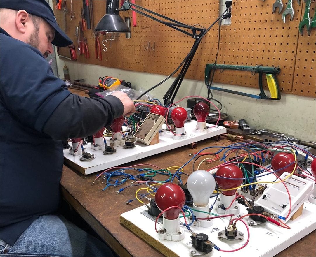 ACHP 106 hands-on bench work with refrigerant gauges