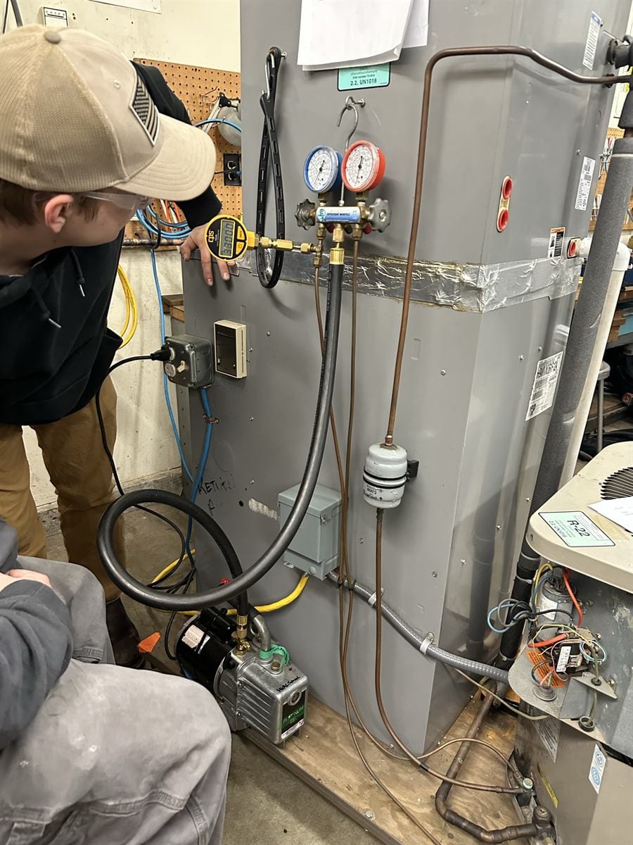 ACHP 106 close work inside an open AC unit