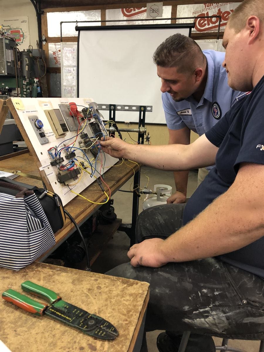 GS 102 student investigating a no-heat call on a gas furnace