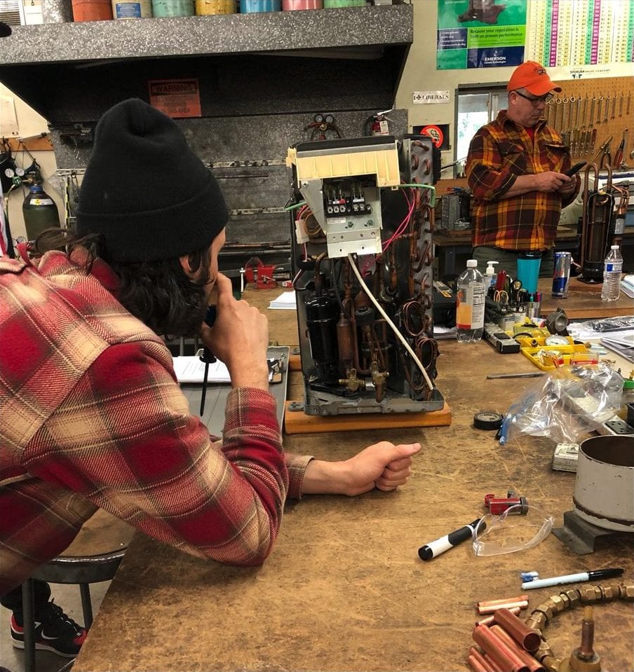 RS 103 student performing a residential AC service procedure