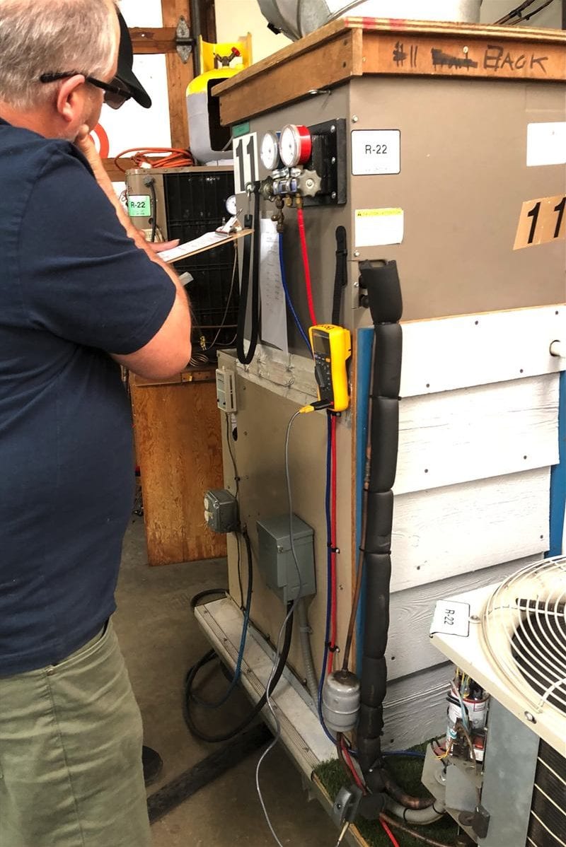 RS 103 instructor demonstration on a residential service unit