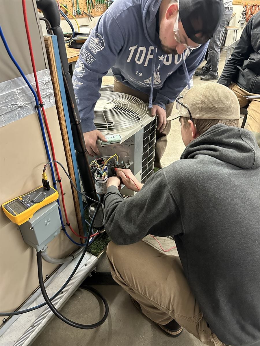 RS 103 student at a residential AC training station