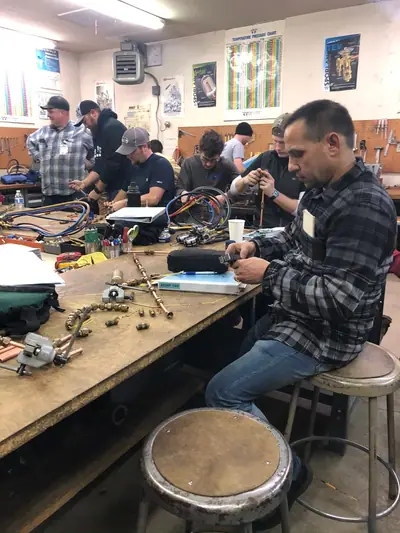 Student forming flare on copper tubing