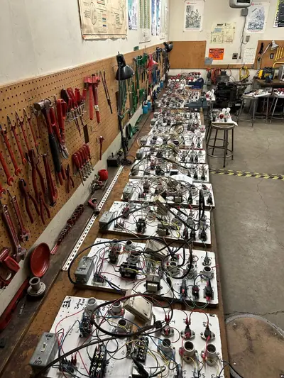 Tools and wiring boards on HVAC training bench